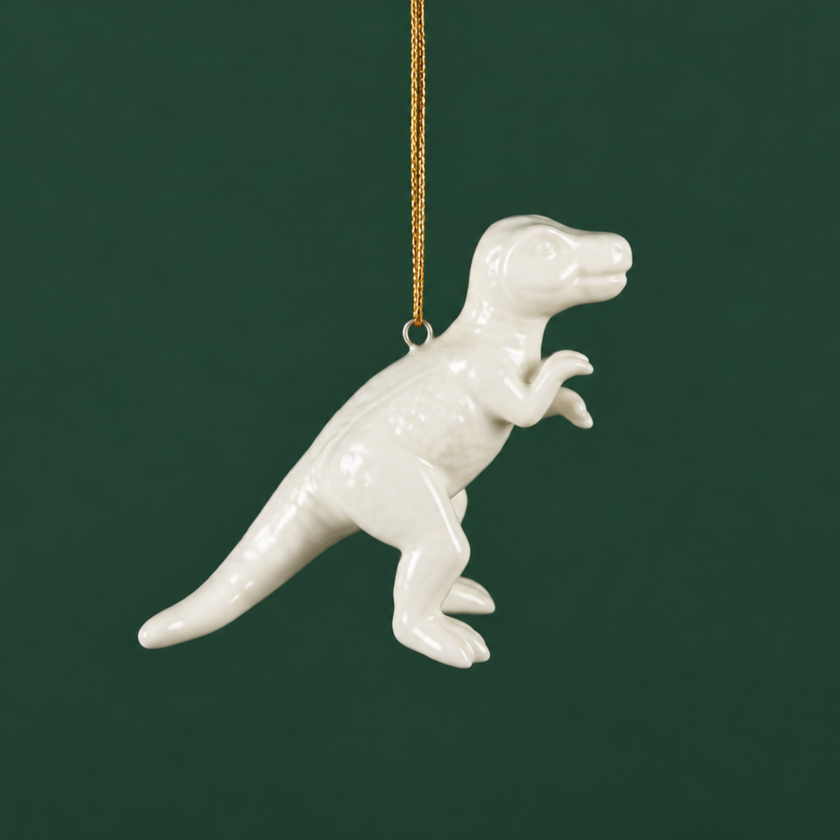 a white t-rex shaped ornament 
