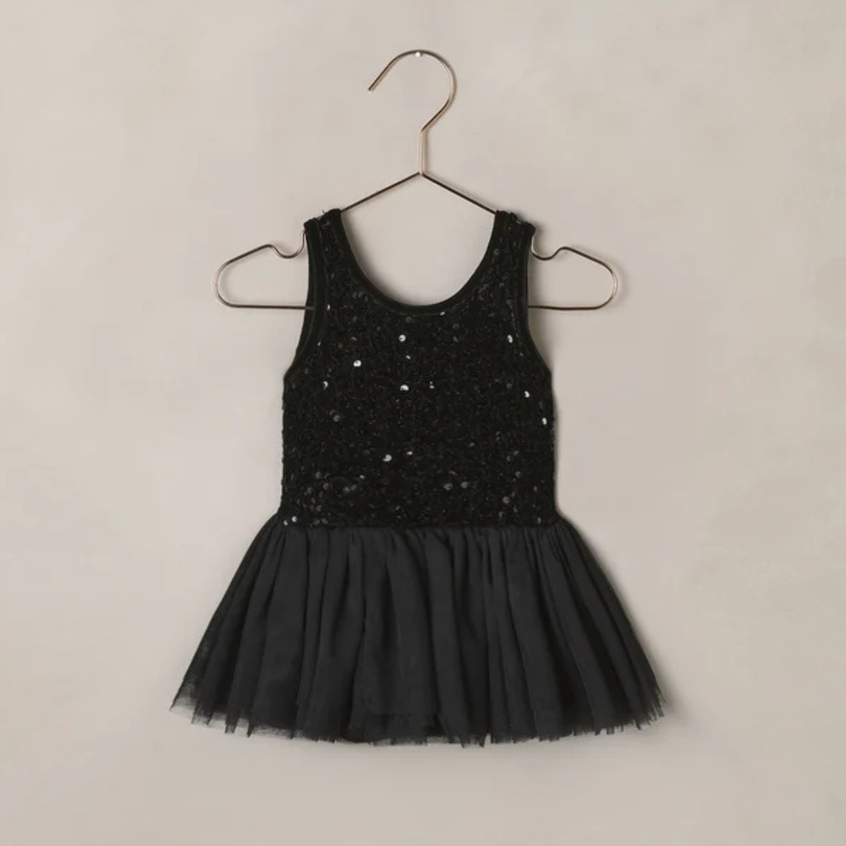 a black sequin tutu dress onesie. 