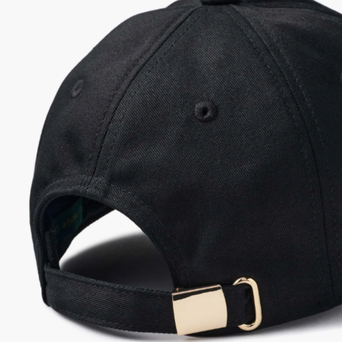 a black baseball hat with white embroidered text that reads, "Team Spirit" with three embroidered ghosts. 