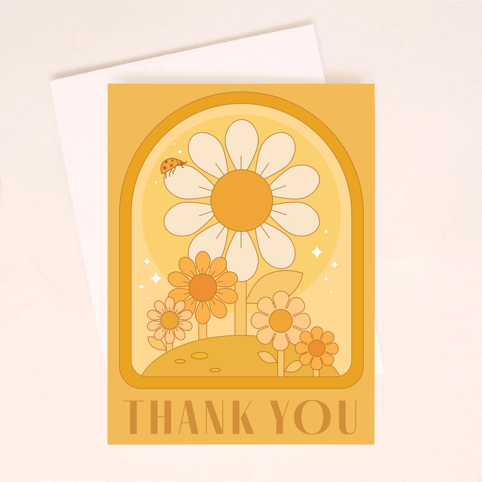 On an ivory background is an orange greeting card with an arch and daisy design with a small ladybug sitting on the largest daisy as well as dark orange text along the bottom the reads, &quot;Thank You&quot;.