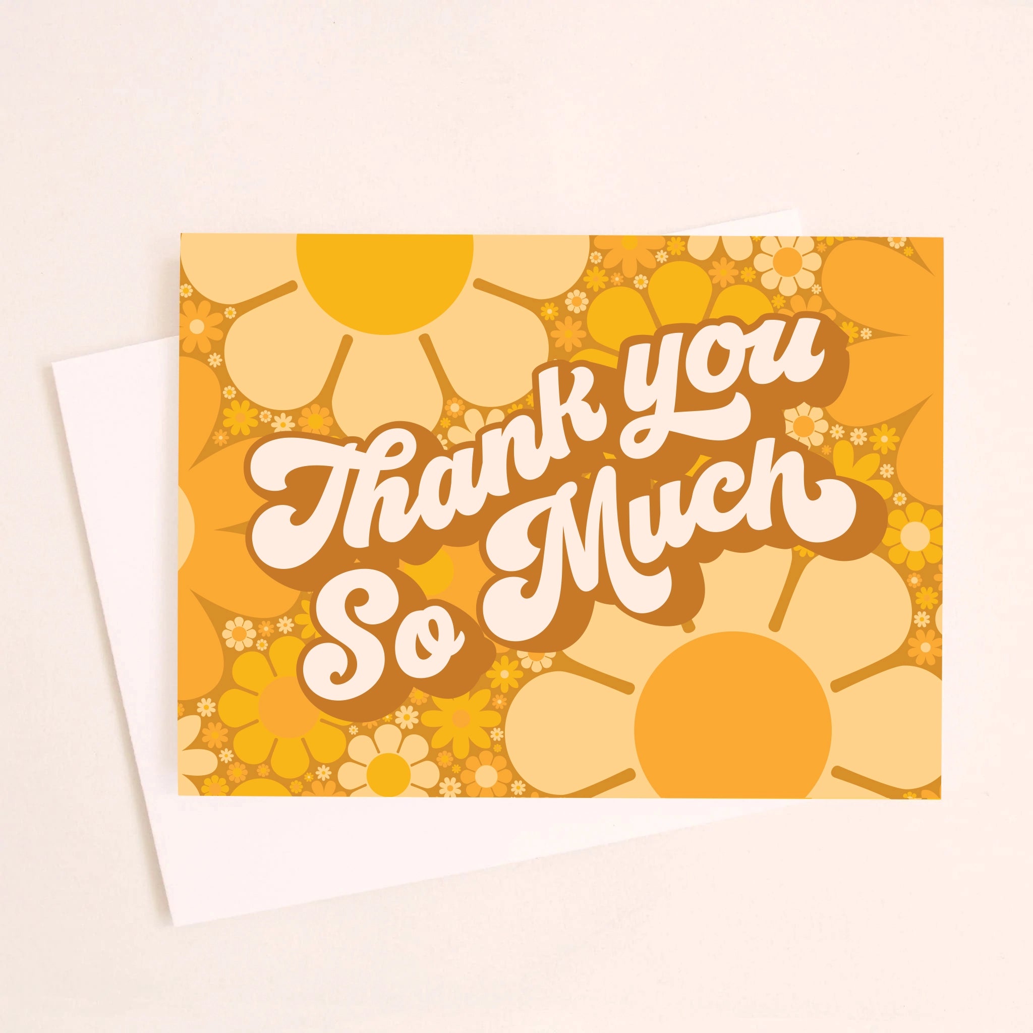 On an ivory background is a daisy printed thank you card with shades of orange and yellow along with white text in the center that reads, &quot;Thank You So Much&quot;.