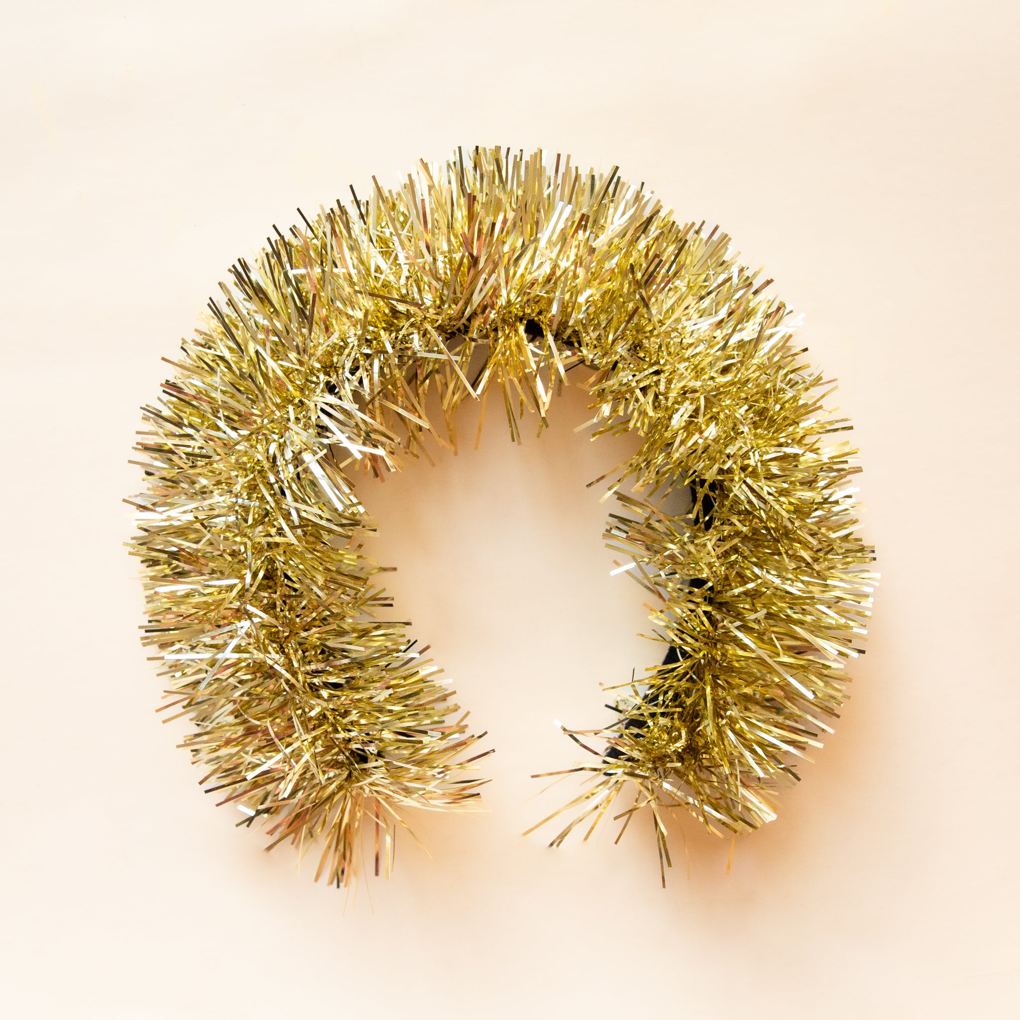 A gold tinsel headband. 