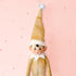 A gold sparkle elf shaped ornament with long limbs. 