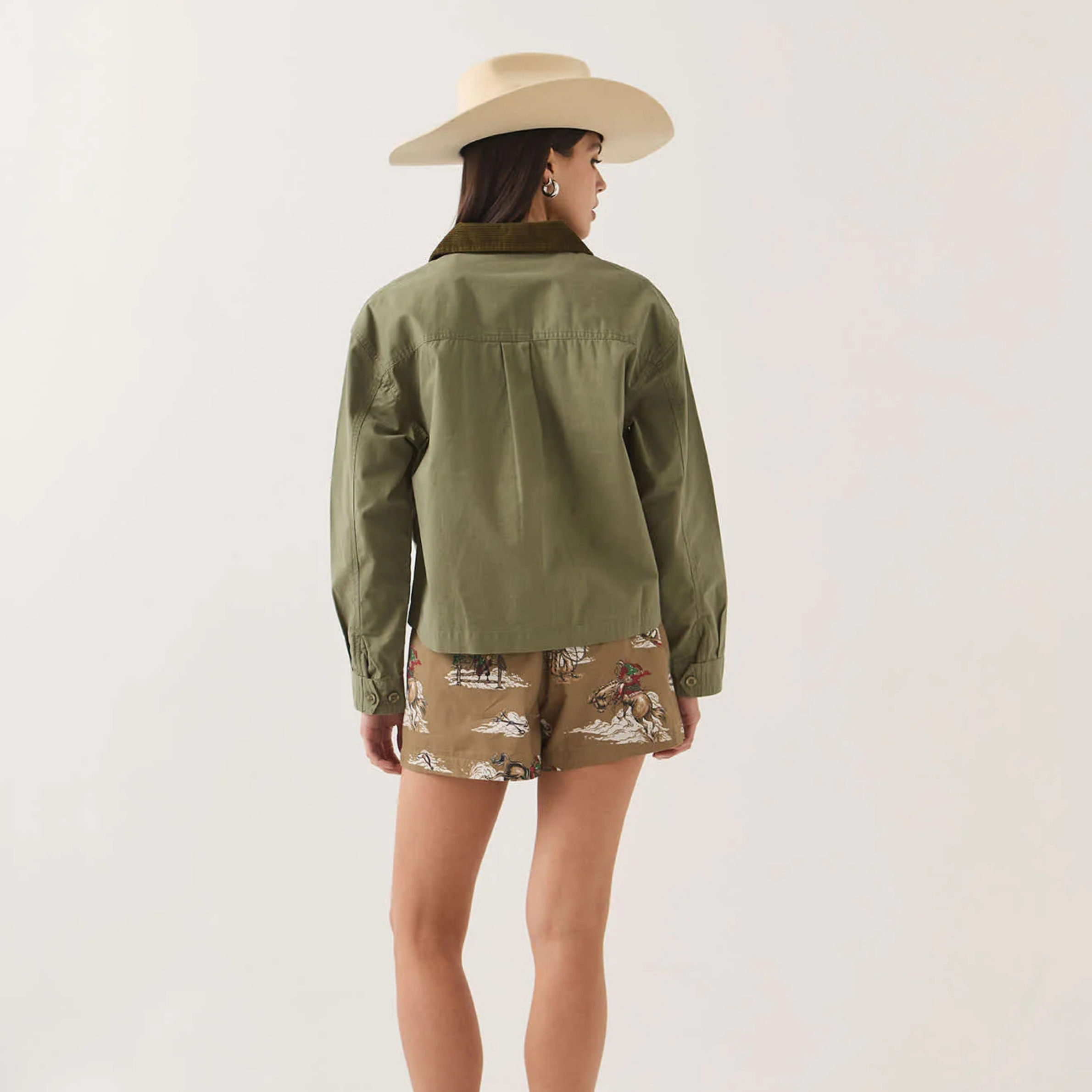 an army green jacket with a corduroy collar. 