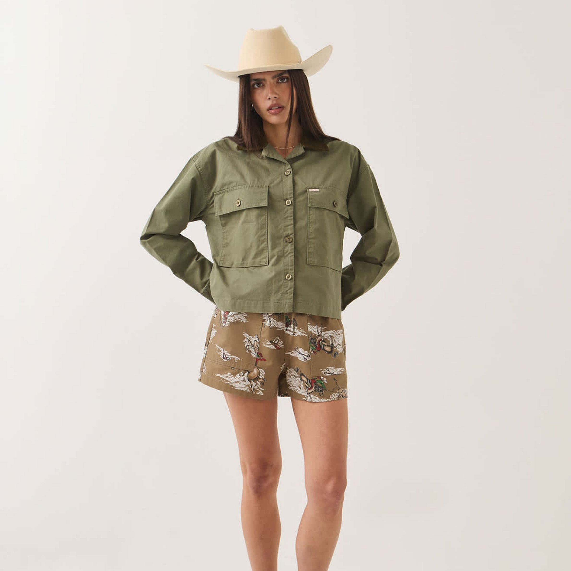 an army green jacket with a corduroy collar. 