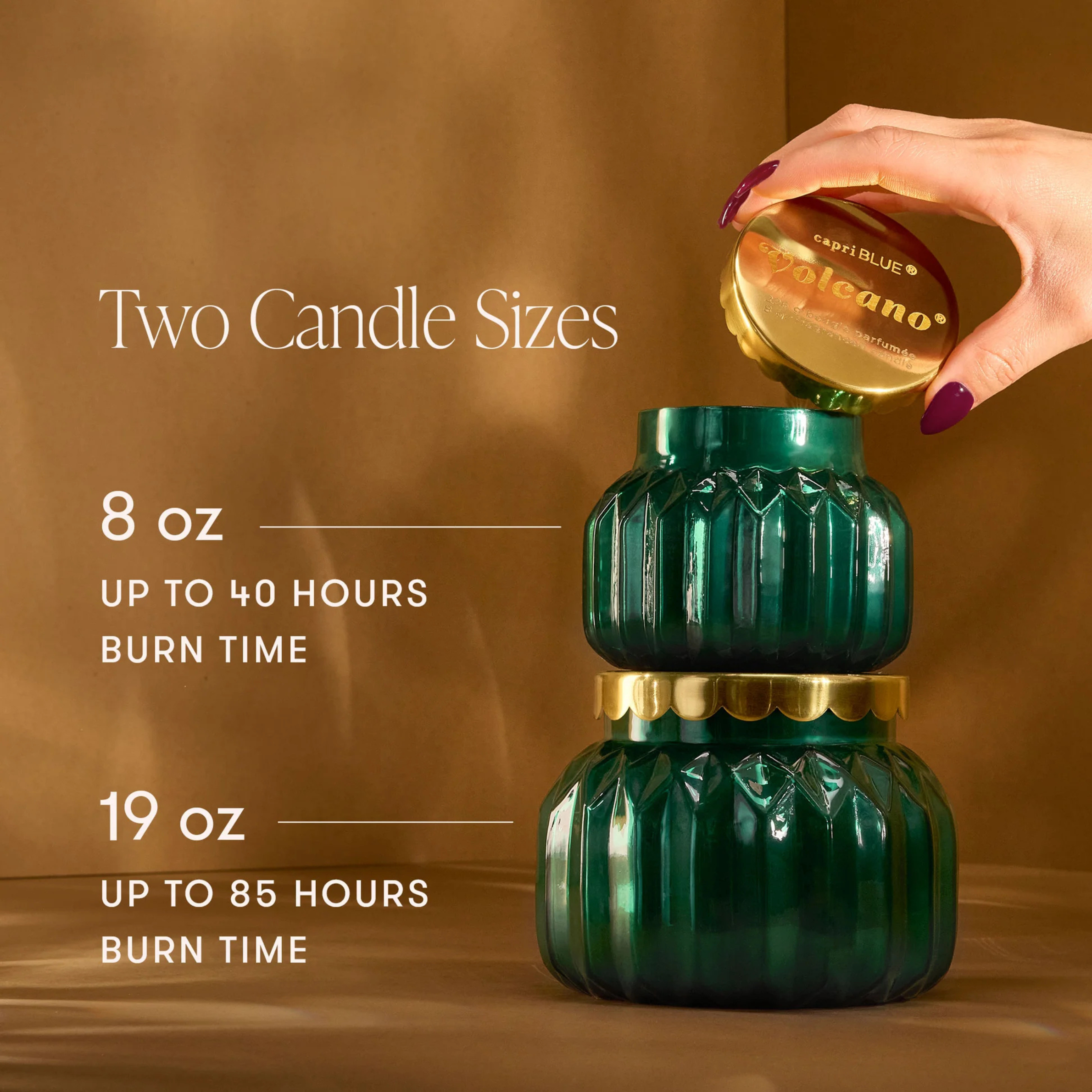 green glass jarred candles with a gold lid. 