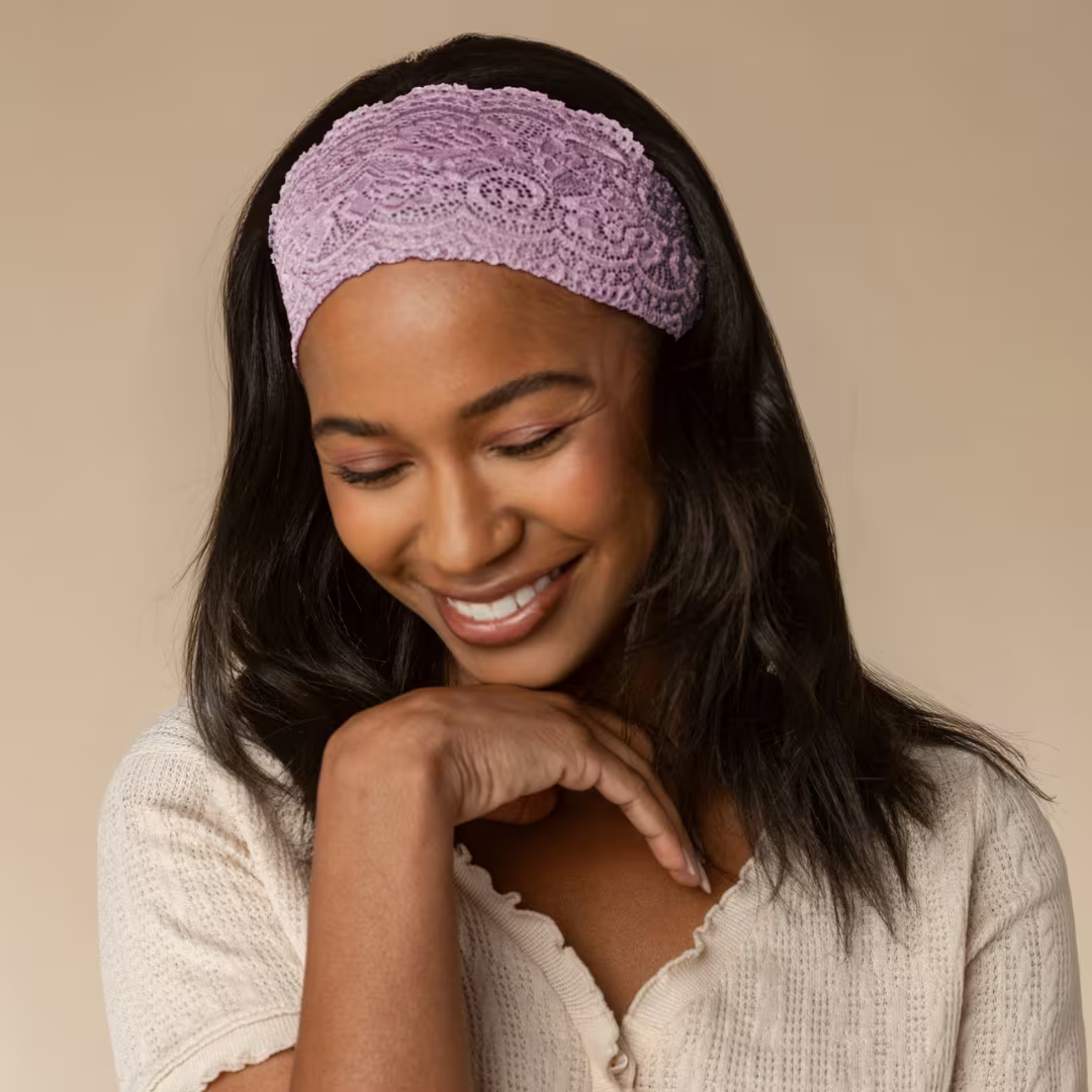 two wide lace headbands, one in a cherry color and the other in a pink
