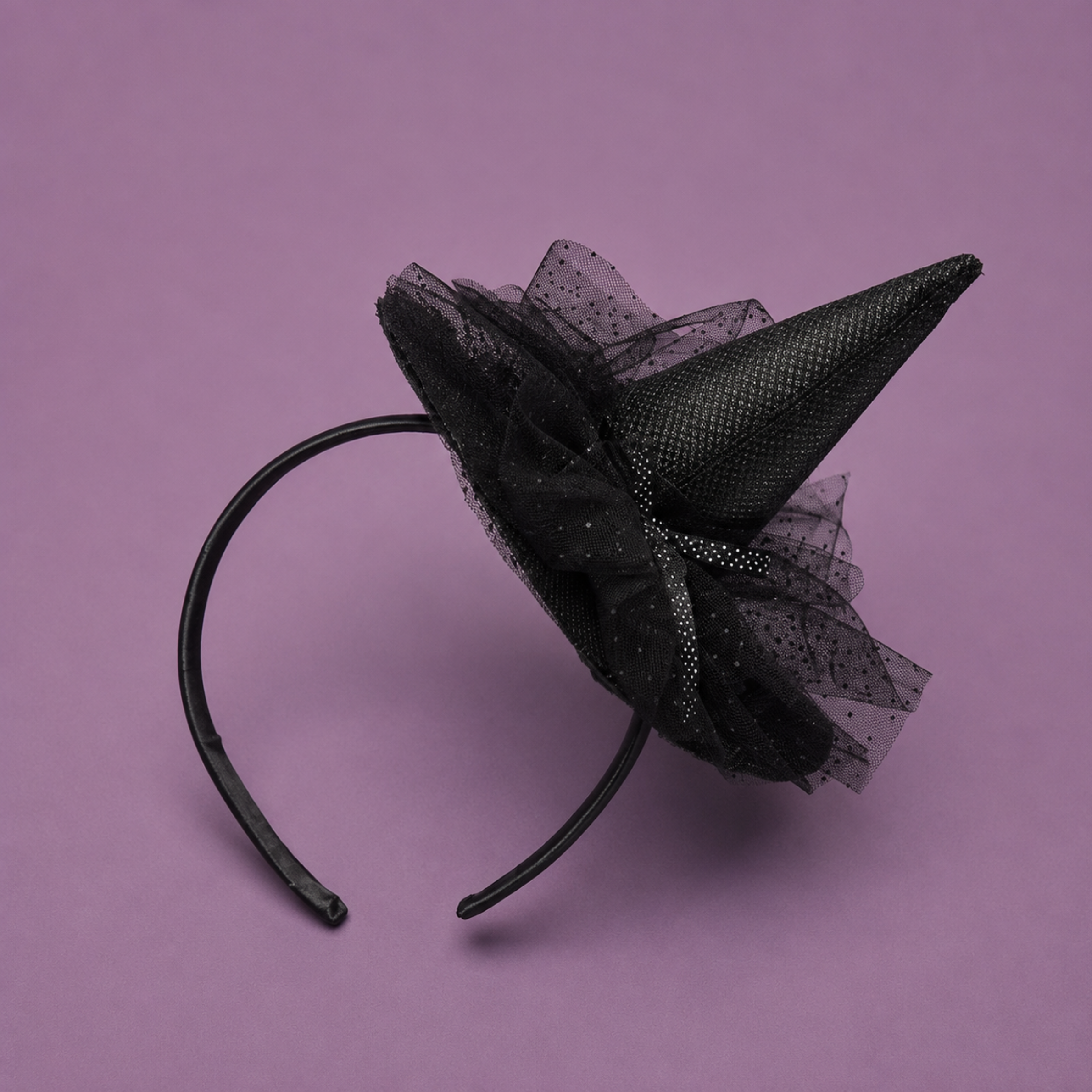 A black headband with a black witch hat.