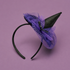 A black headband with a purple and black witches hat. 