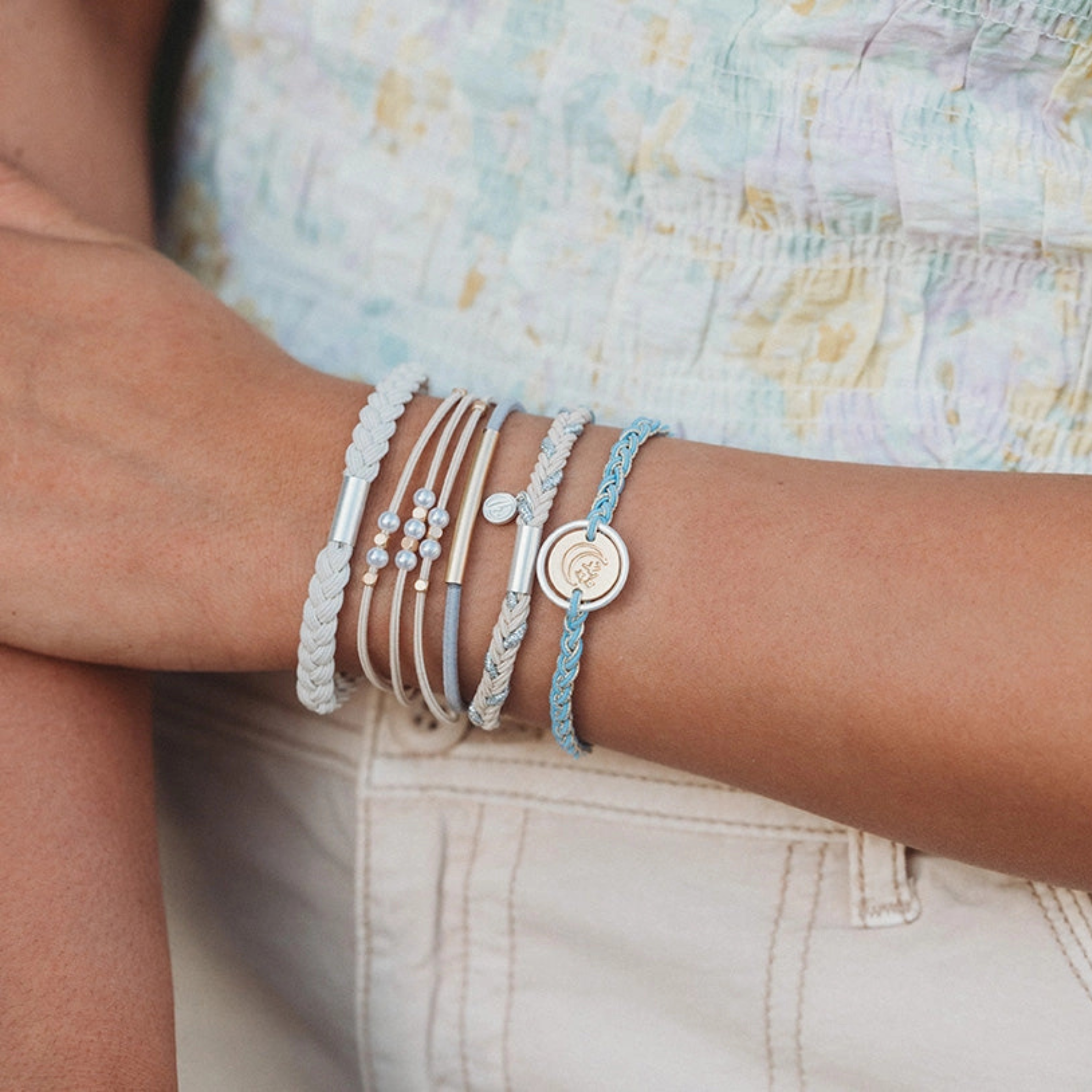 Collection of hair ties with decorative elements on a light background
