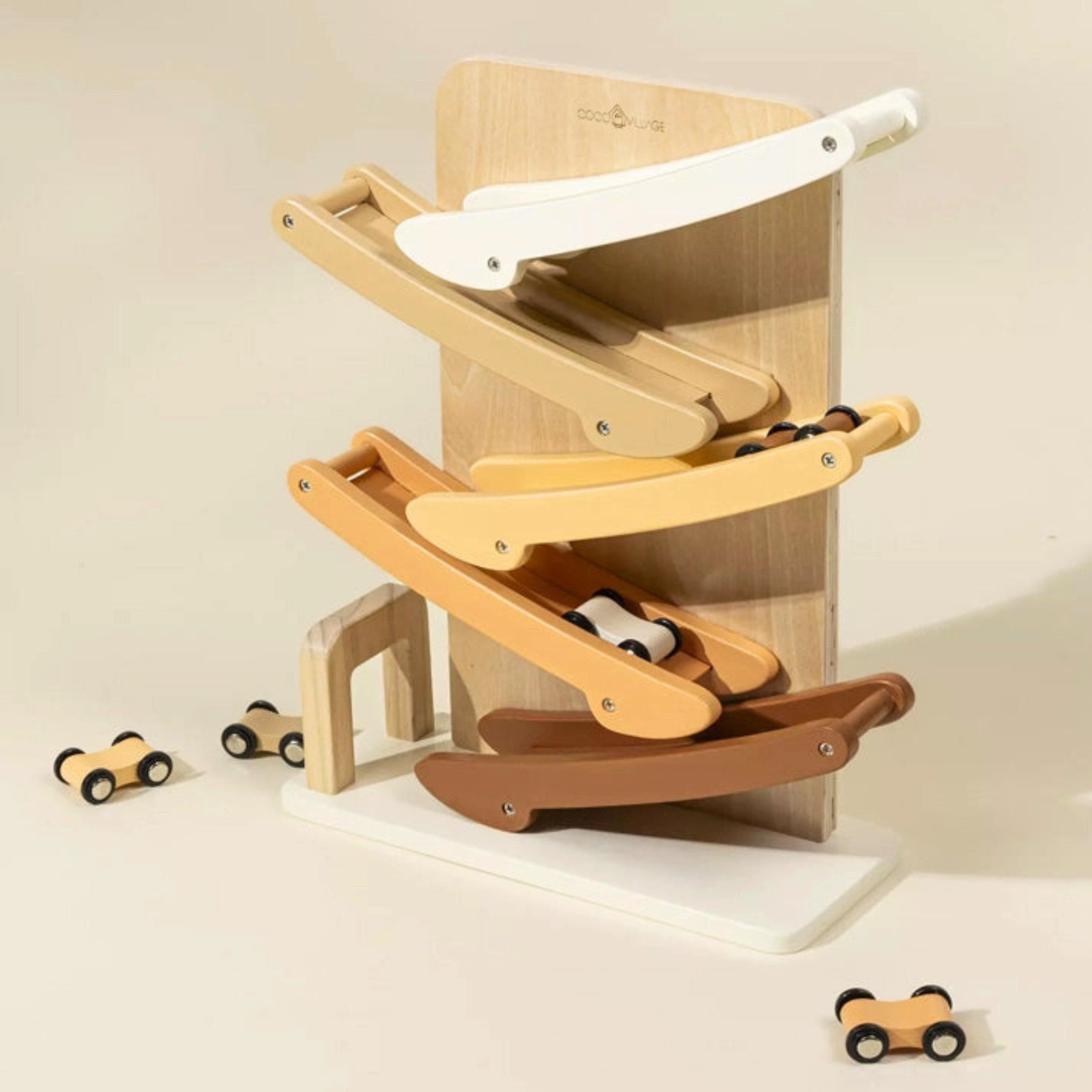 Wooden toy with multiple levels and small cars on a beige background