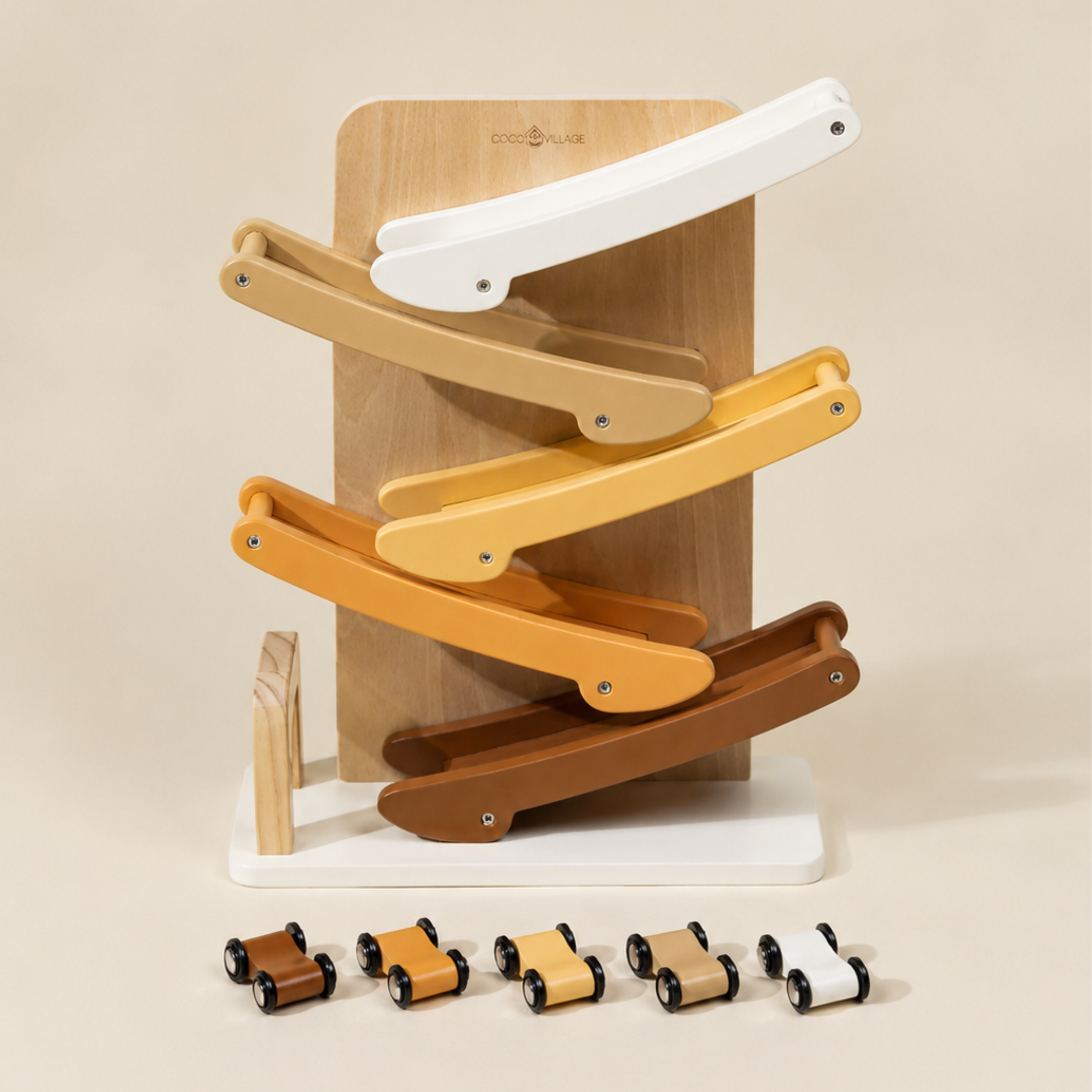 Wooden toy with multiple levels and small cars on a beige background