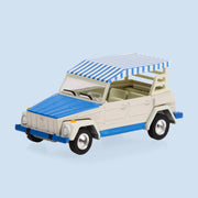 A white VW min toy. 