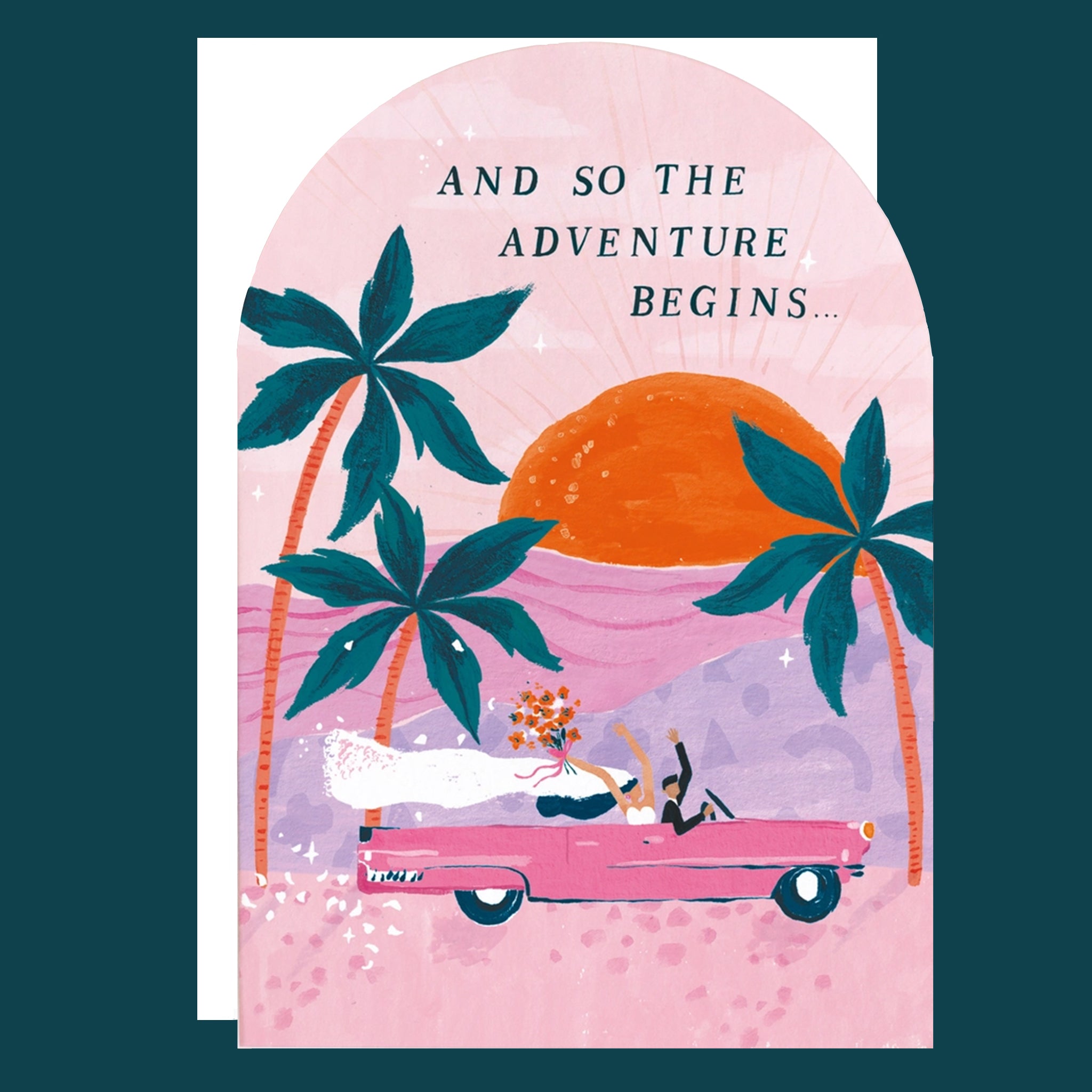 A pink arched greeting card featuring three palm tree illustrations along with a pink vintage car riding into the sunset with a bride and groom holding their hands and bouquets in the air as well as text that reads, "And So The Adventure Begins..." in black letters.