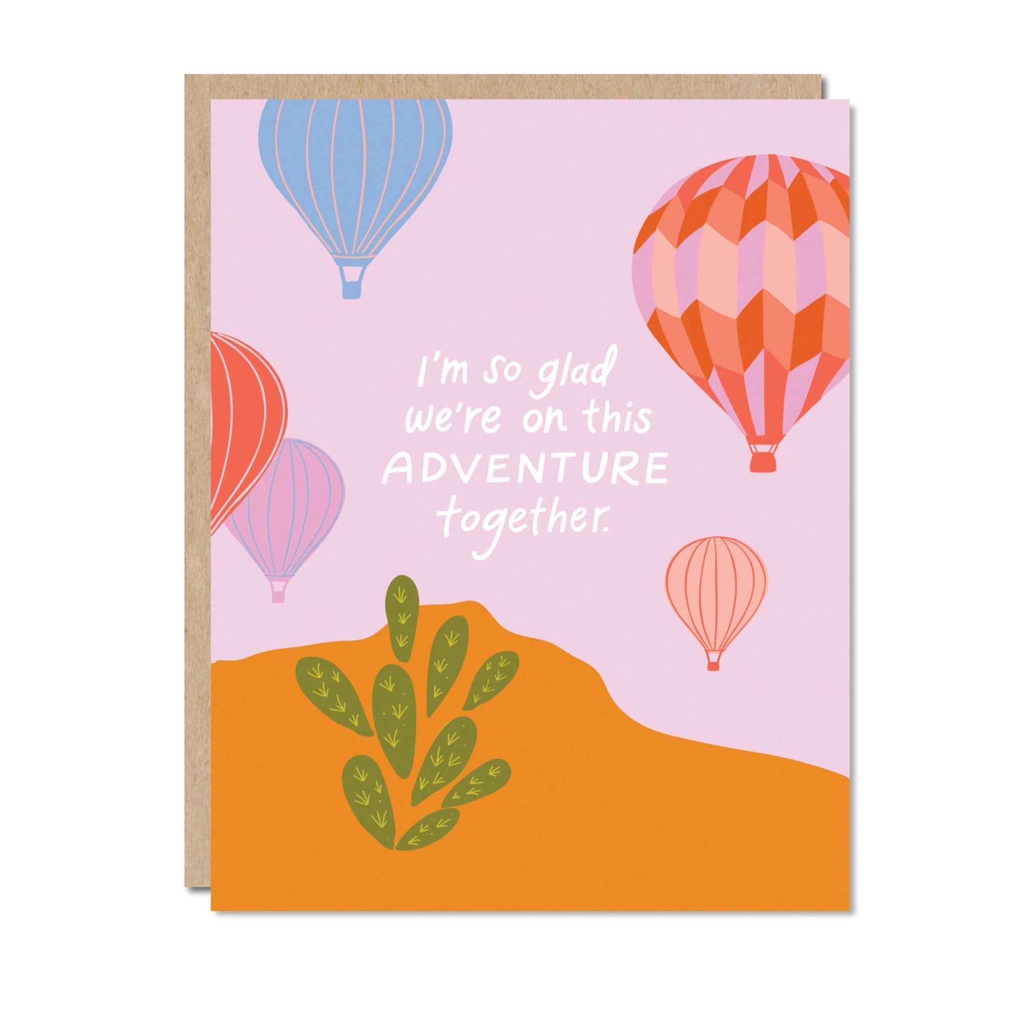 On a white background is a purple and orange card with air balloon graphics and white text in the center that reads, &quot;I&#39;m so glad we&#39;re on this Adventure together&quot;. 