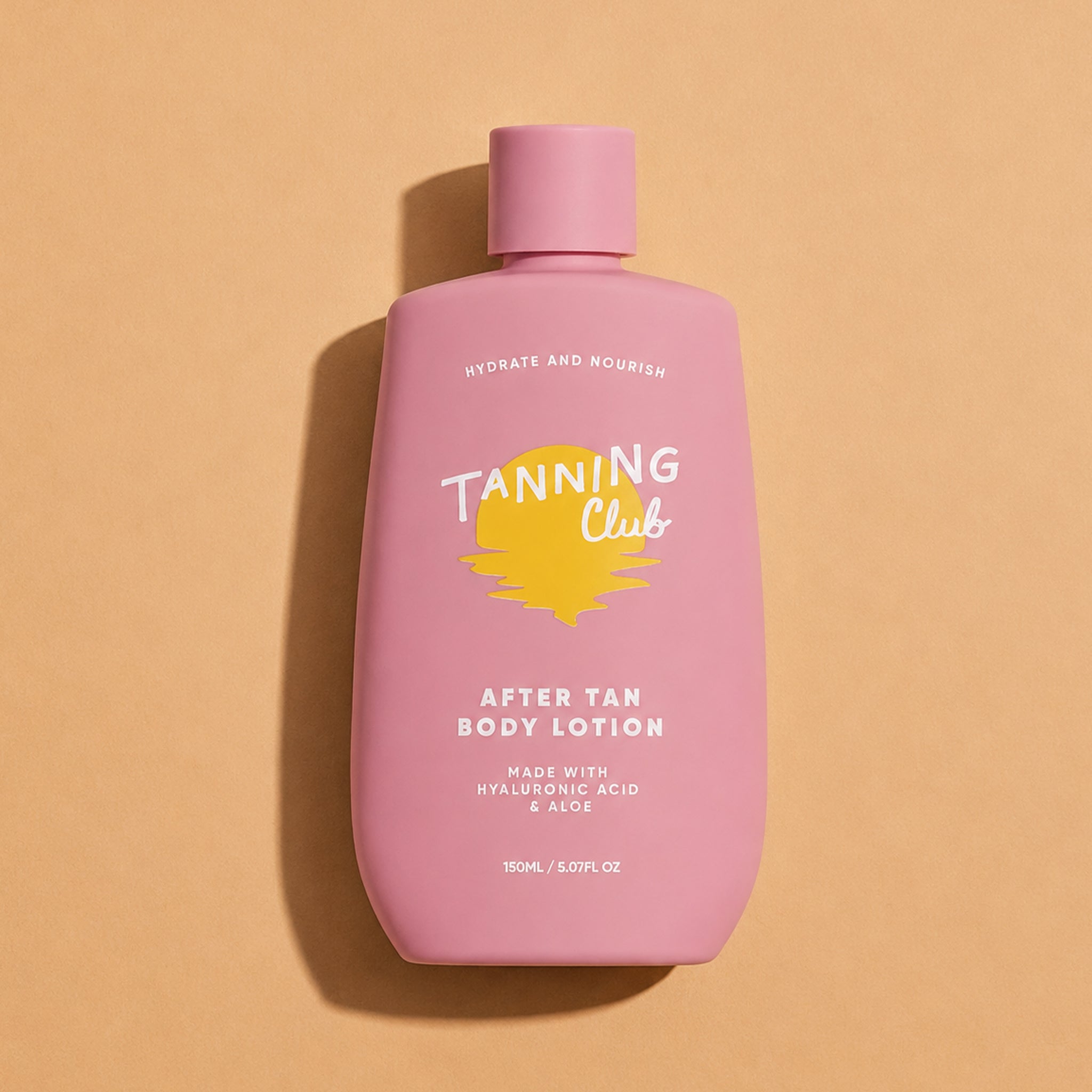 Pink bottle of Tanning Club after tan body lotion on a beige background