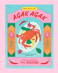 A multi colored cook book with an illustration of a crab dish on a plate and red text that reads, 'Agak Agak Everyday Recipes From Singapore'. 