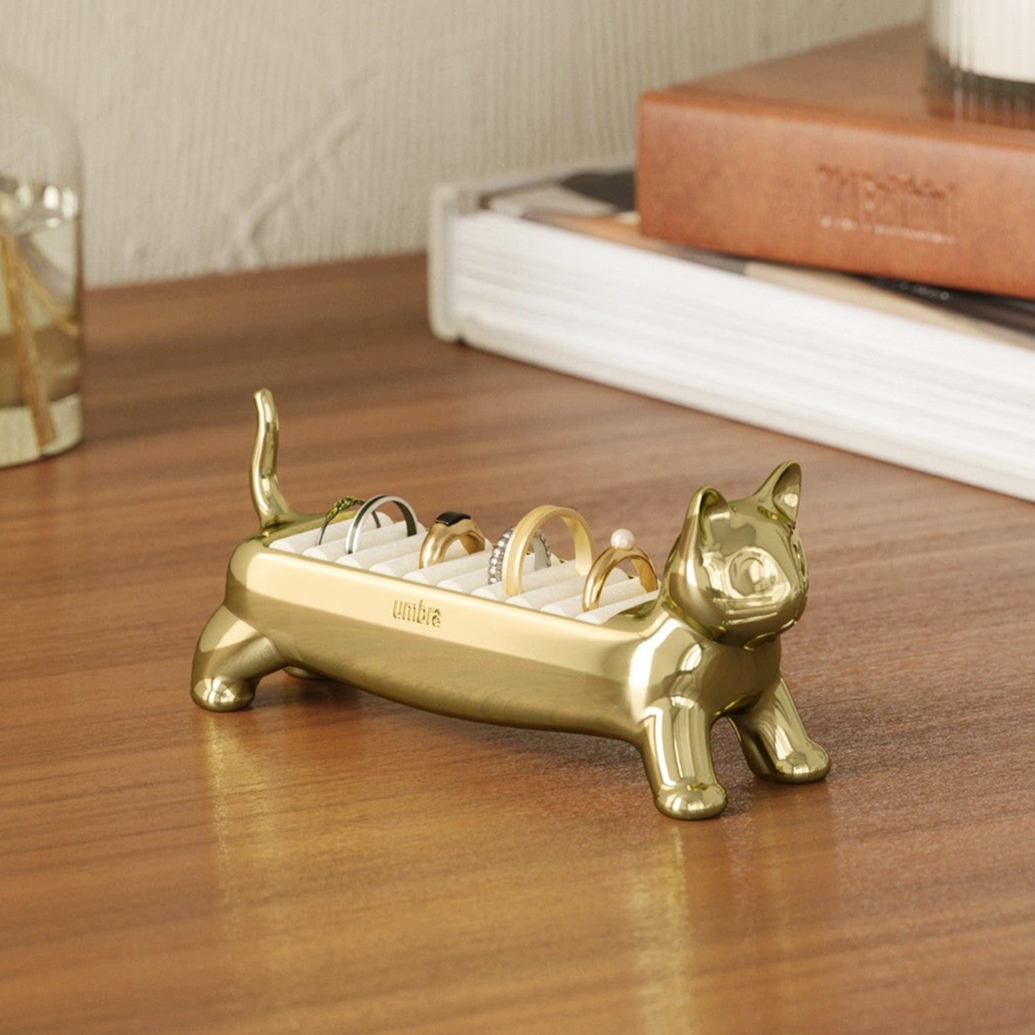 A gold cat shaped ring holder. 