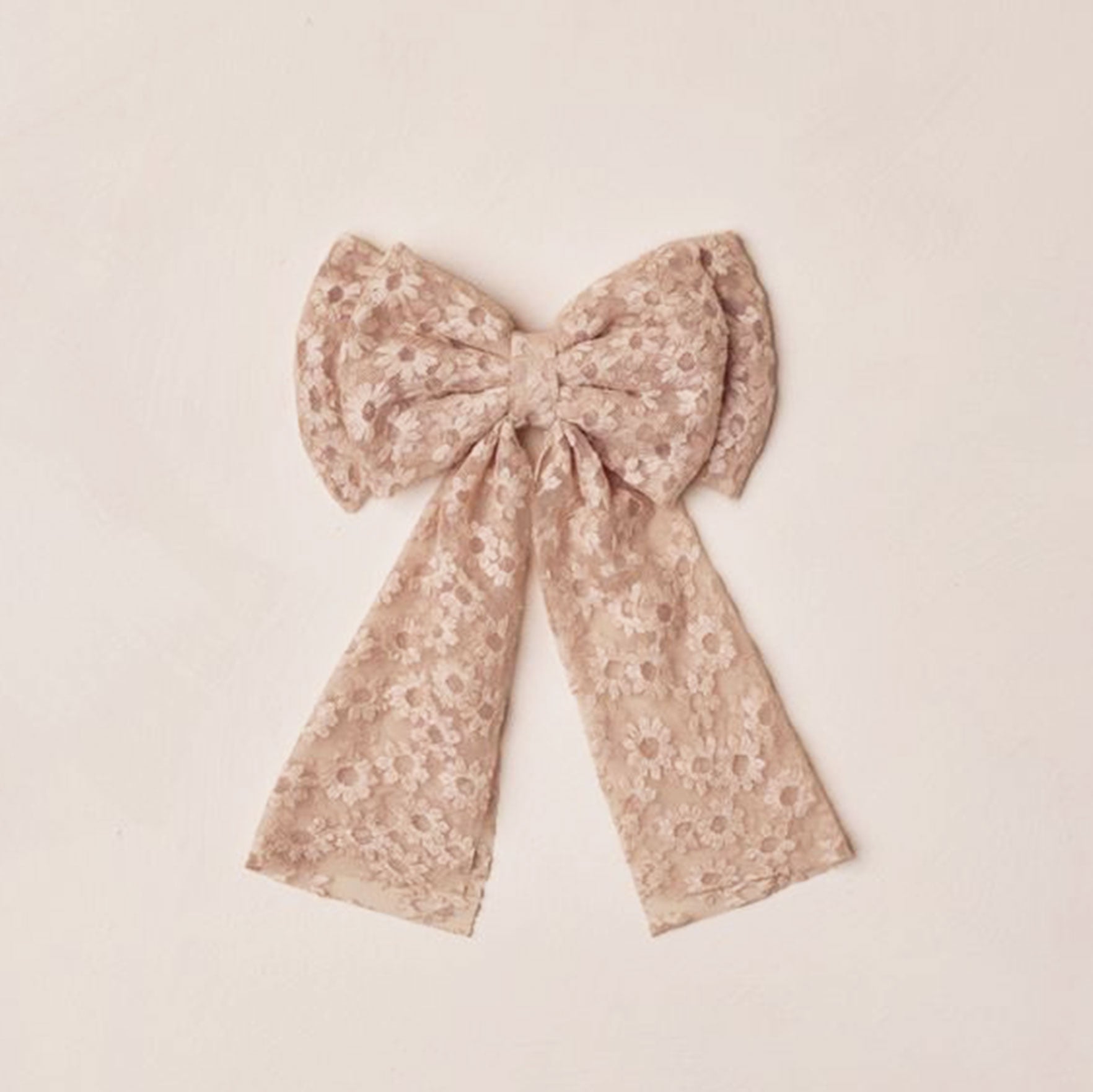 Light pink hair bow with embroidered flowers. 