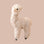 A cream colored alpaca ornament. 