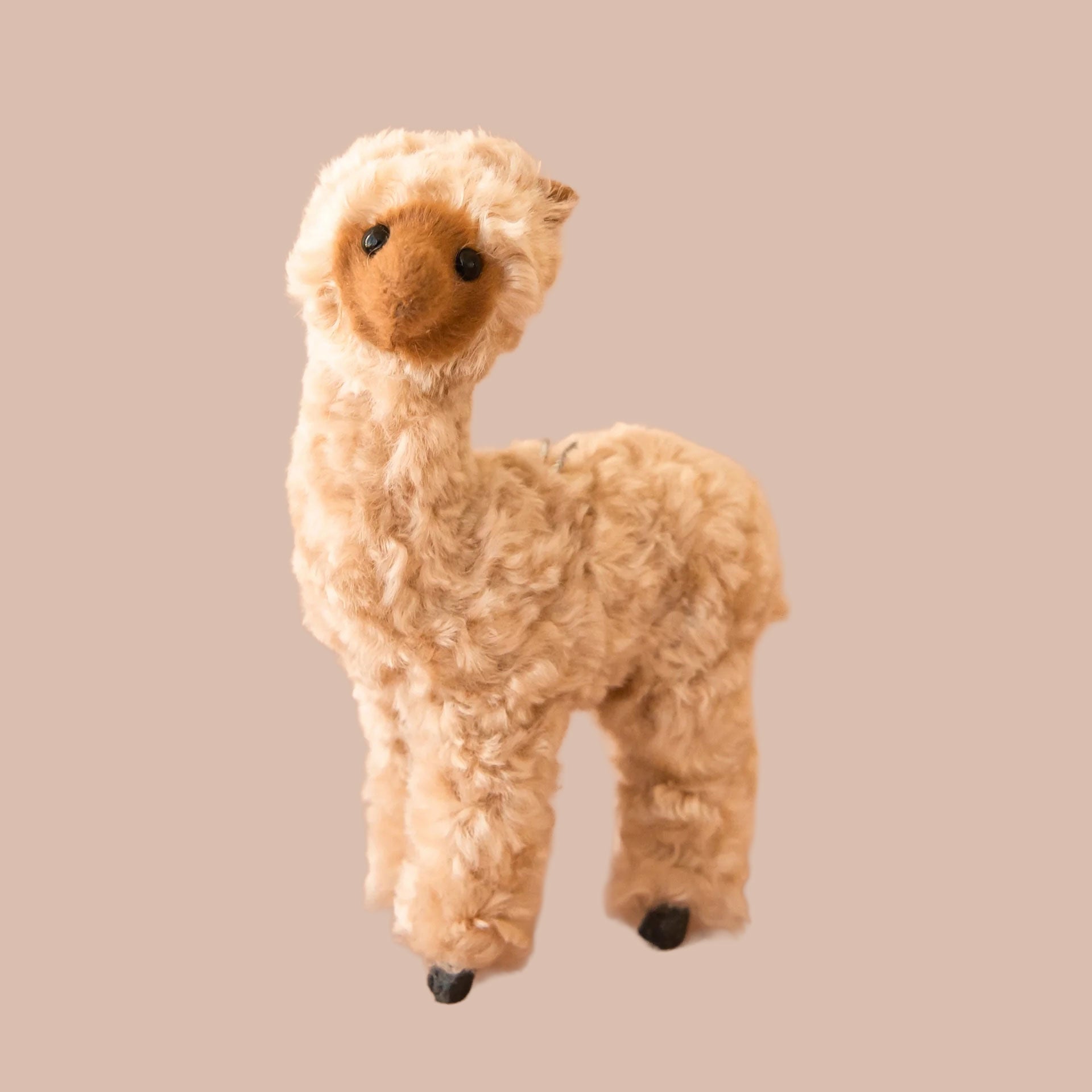 A brown alpaca shaped ornament. 