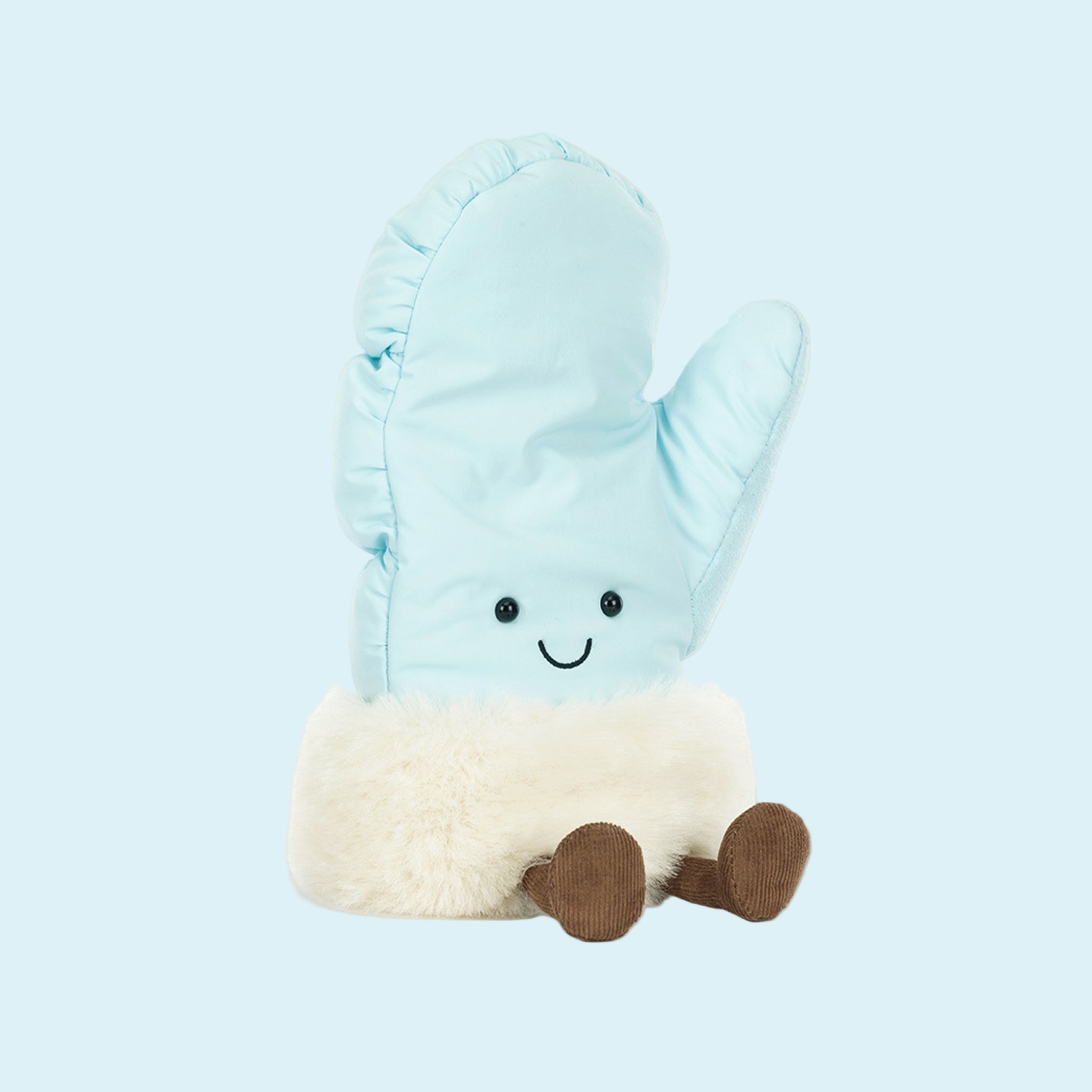 A light blue mitten shaped stuffed toy with a smiling face and legs. 