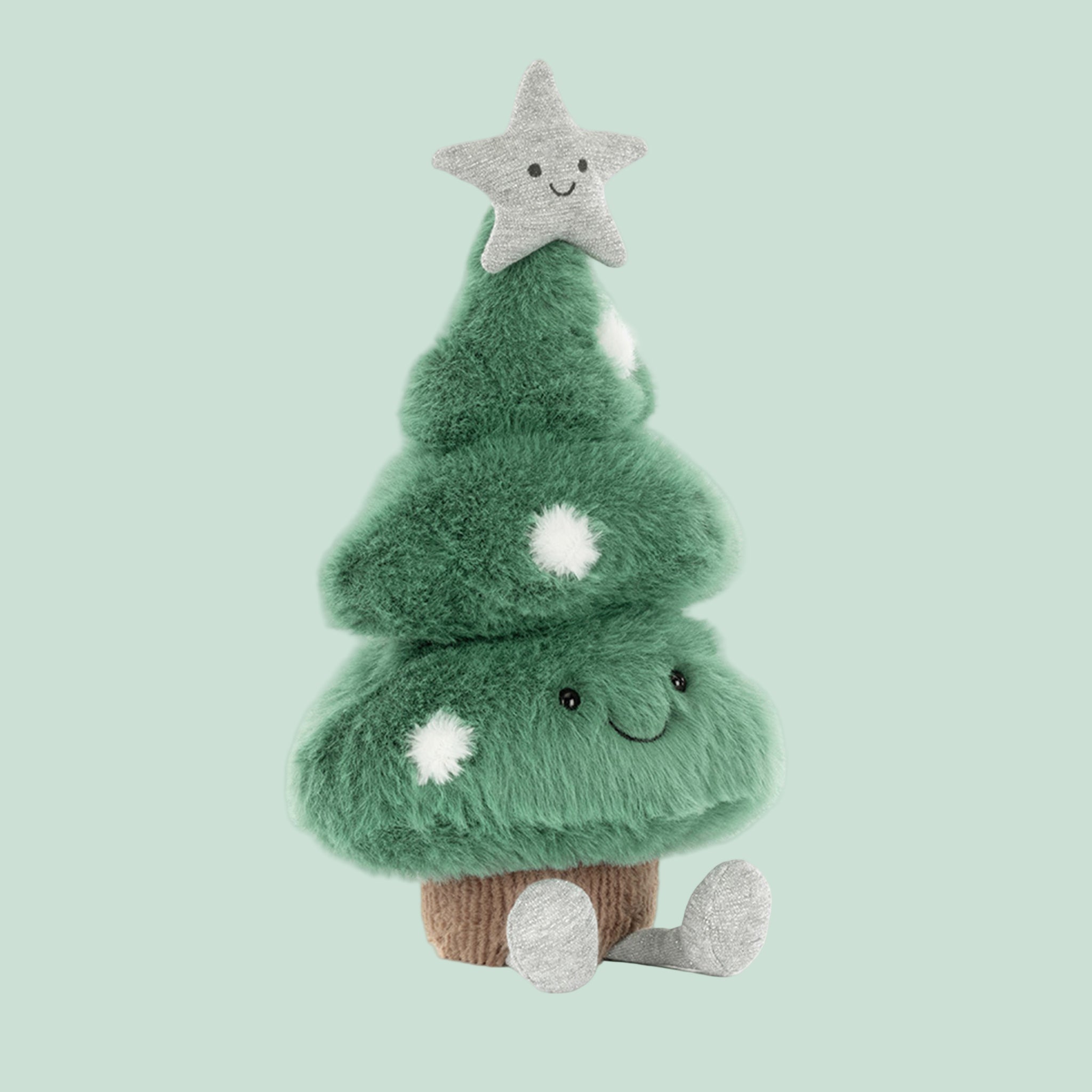 A green Christmas tree shaped tree stuffed toy with a star on top and adorable legs. 