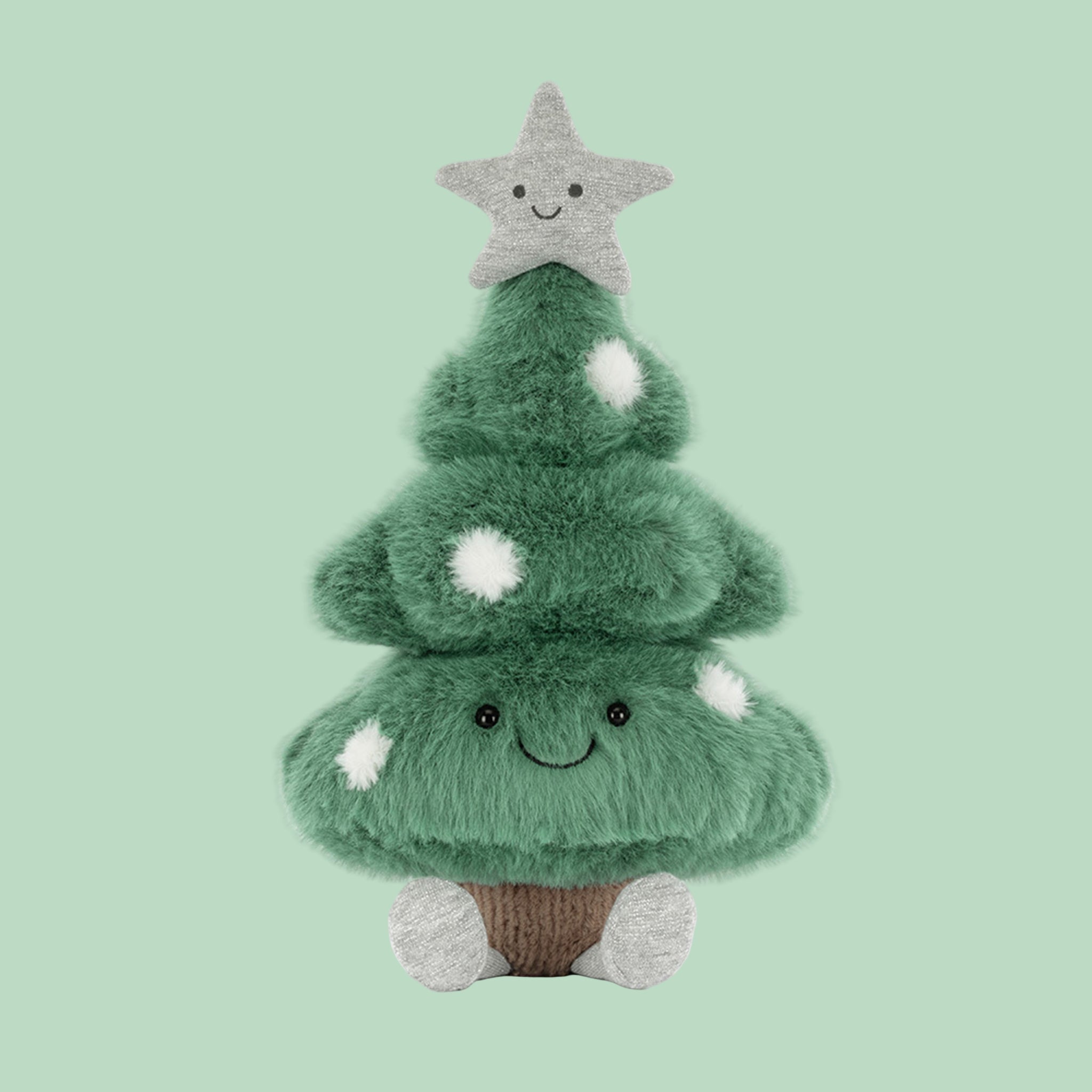 A green Christmas tree shaped tree stuffed toy with a star on top and adorable legs. 