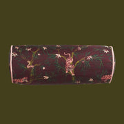 A bolster pillow with a tiger print. 