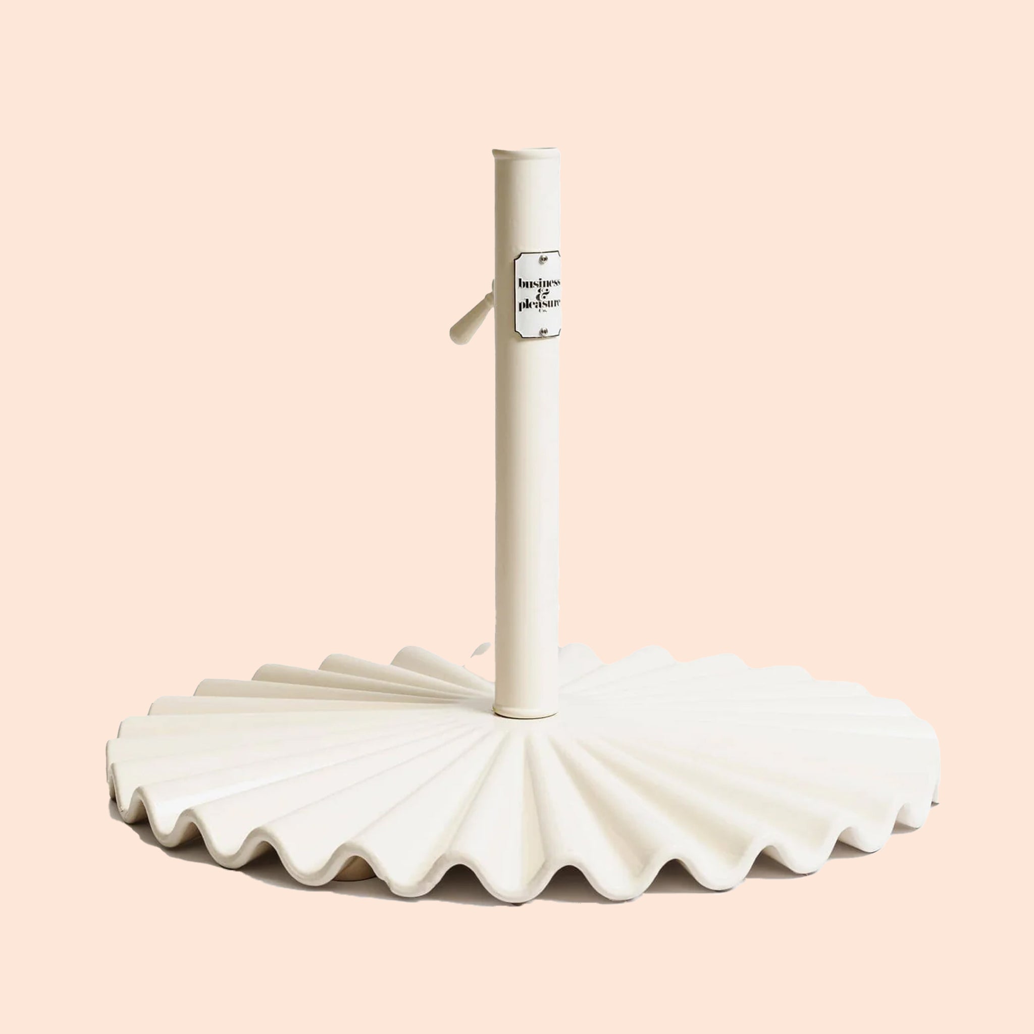 A wavy umbrella base in an antique white color.