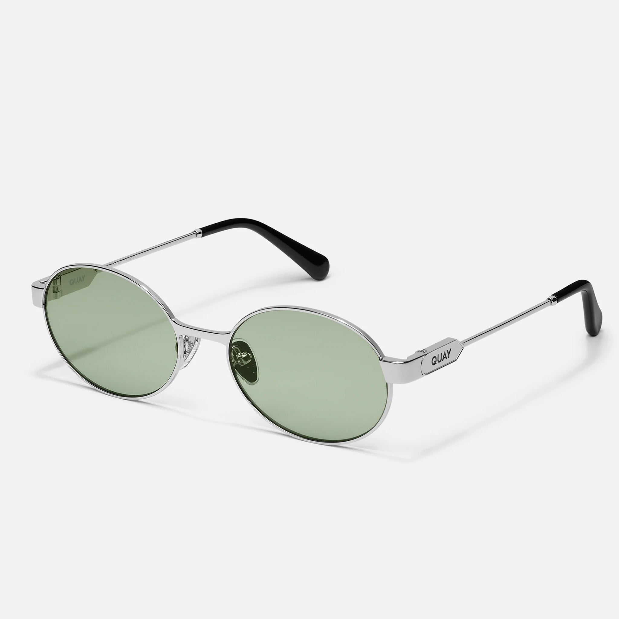 A pair of silver metal oval frame sunglasses with light green lenses. 