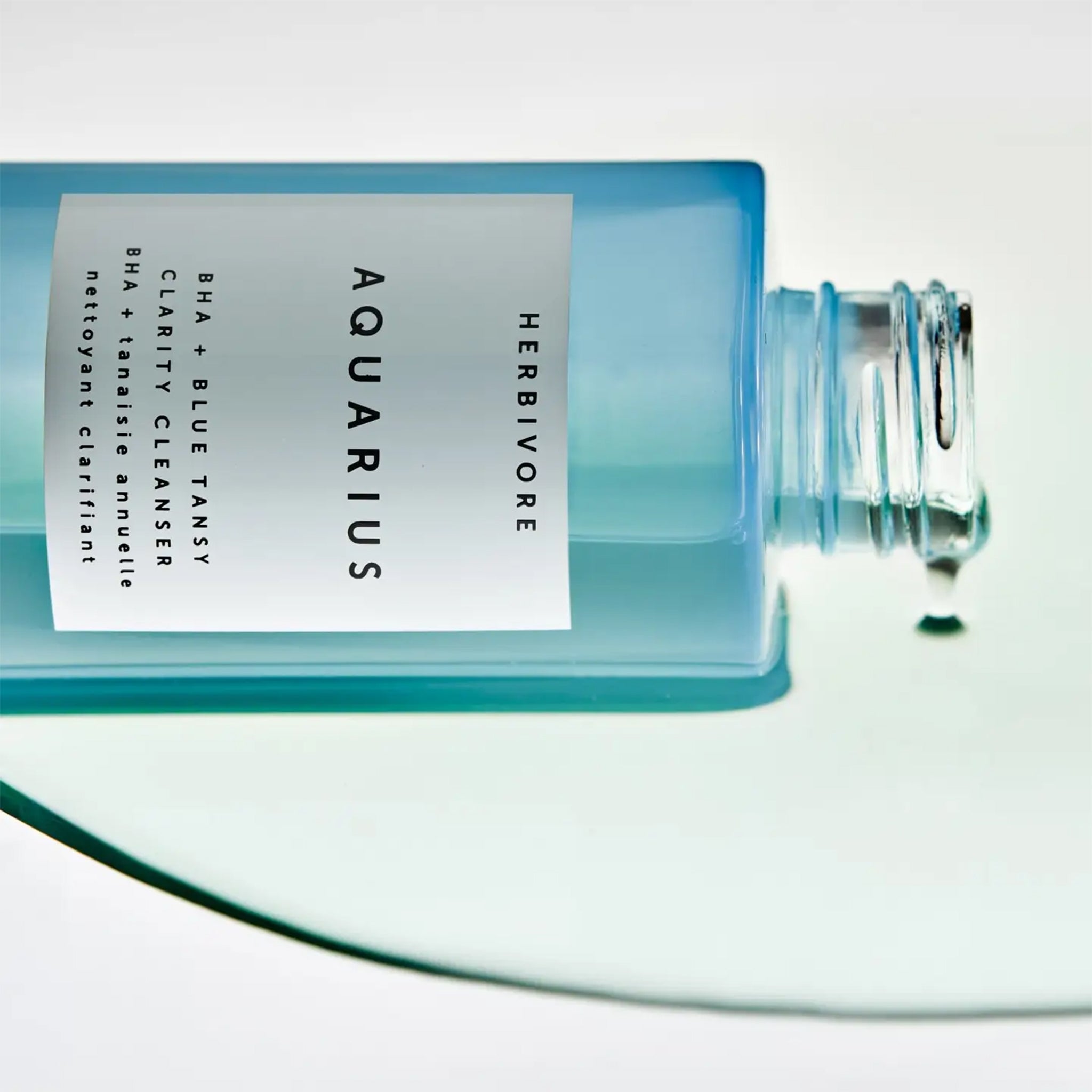 A bottle of cleanser that reads, "Herbivore Aquarius BHA + Blue Tansy". 
