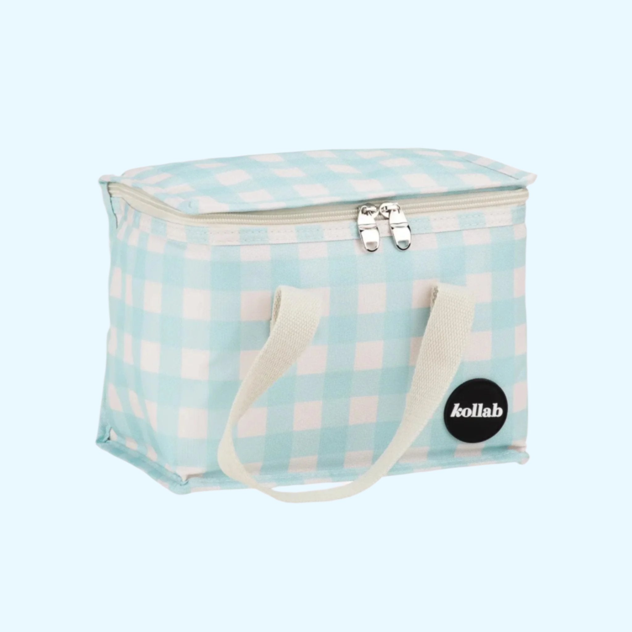 A light blue and white checkered print lunch box with ivory canvas handles. 