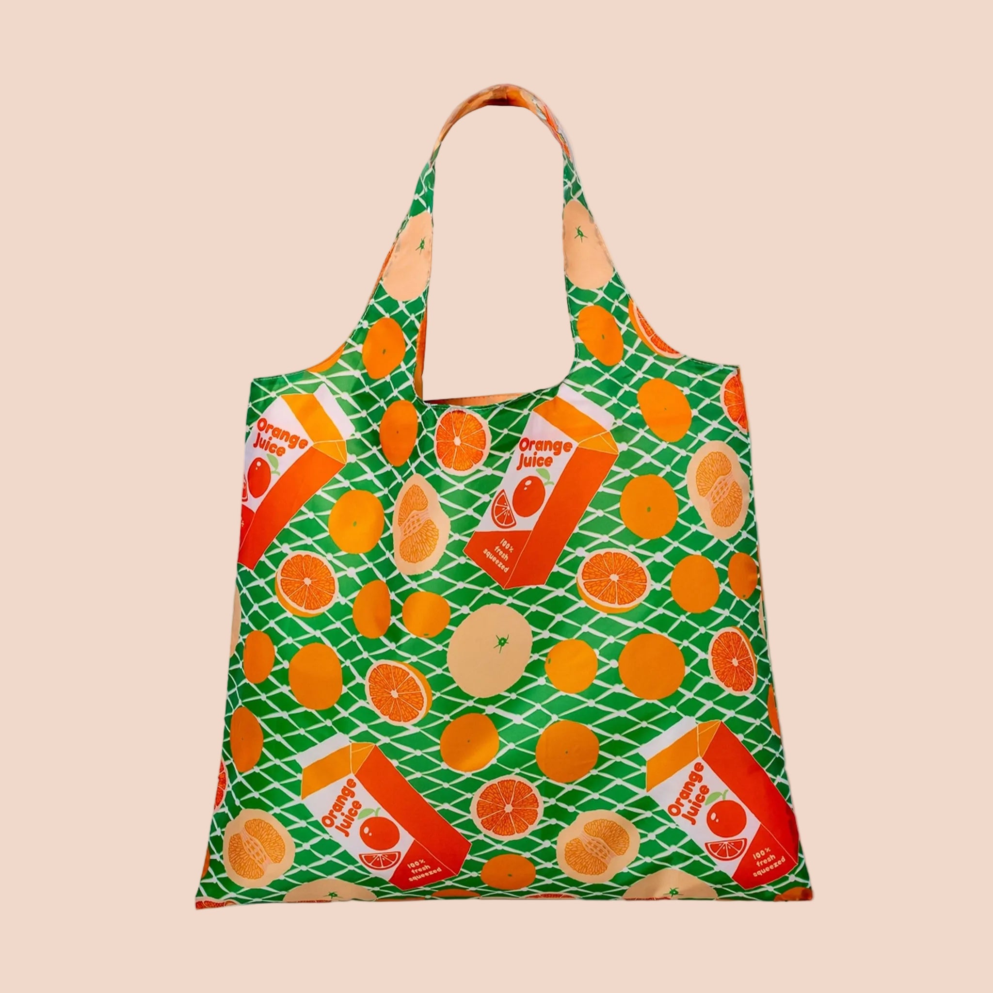 A green and orange foldable tote bag with orange slices and orange juice carton graphics. 