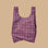 A pink and burgundy pattern nylon tote bag.