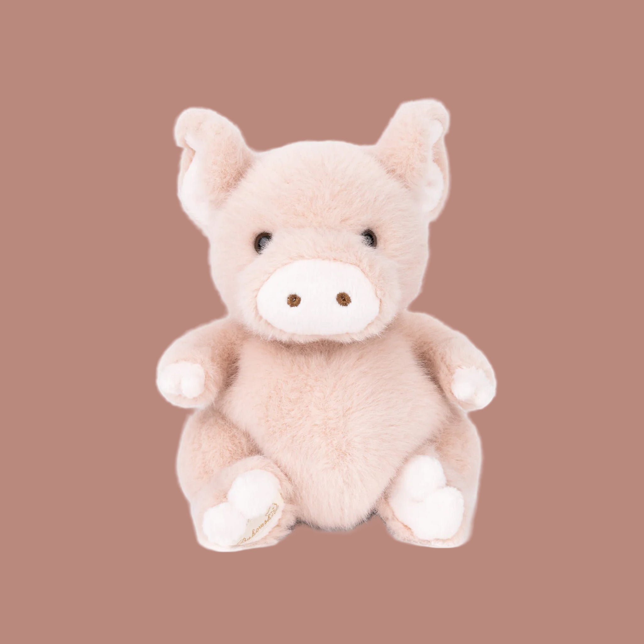 A light pink mini pink shaped stuffed animal. 