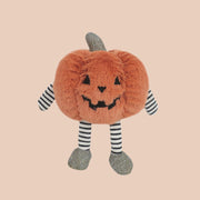 A mini orange pumpkin shaped character stuffed toy with black and white stripe legs and arms. 