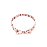 A light pink bow headband. 