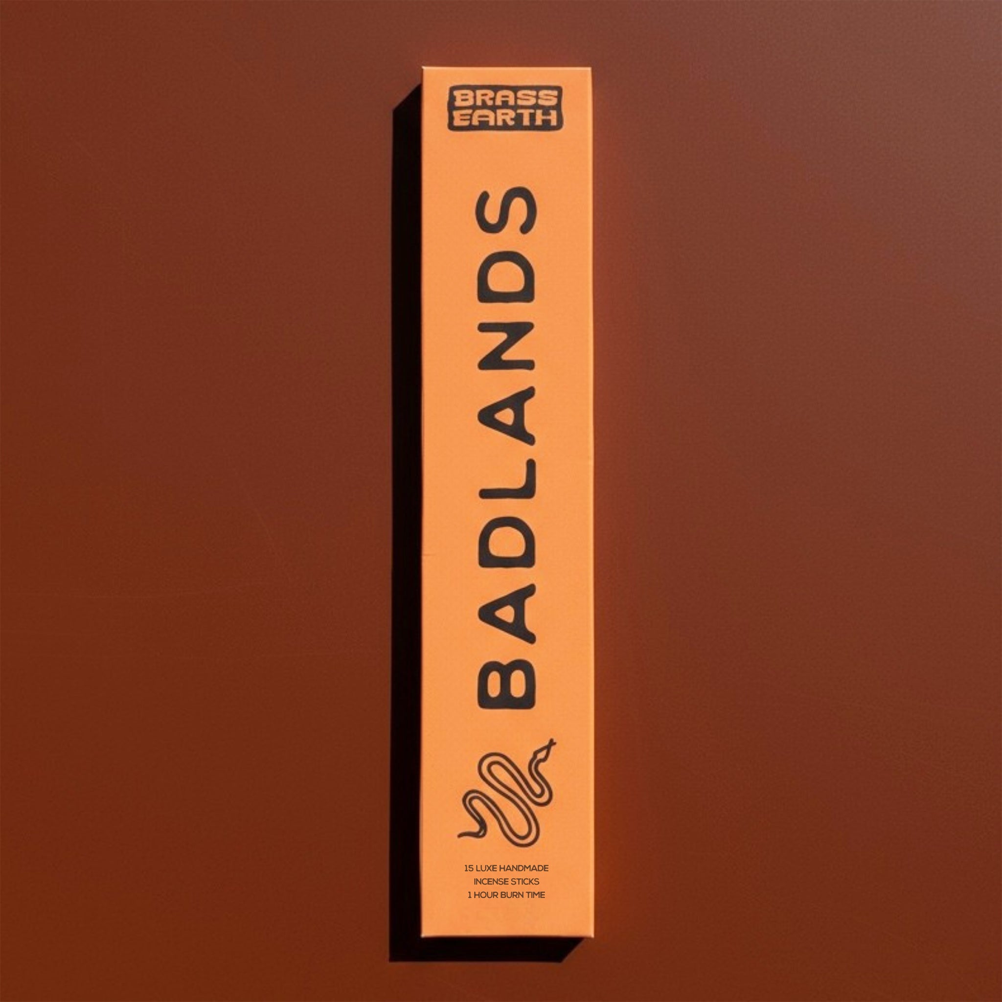 Brass Earth Badlands product packaging on a brown background