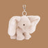 A grey beige elephant bag charm. 