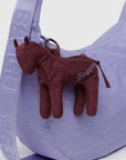 A dark reddish brown horse shaped mini bag charm with a zipper opening. 