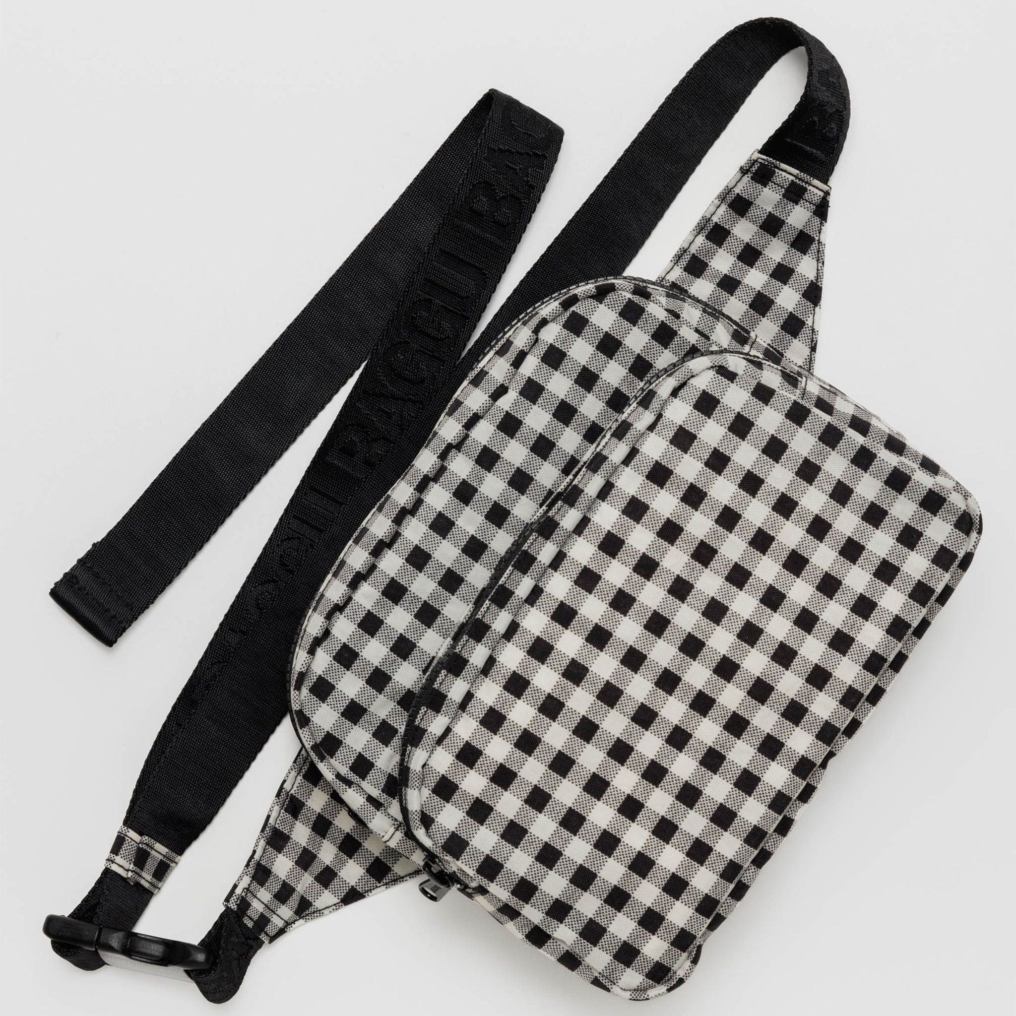 a black and white gingham print fanny pack with black strap