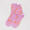 pink socks with orange smiley faces
