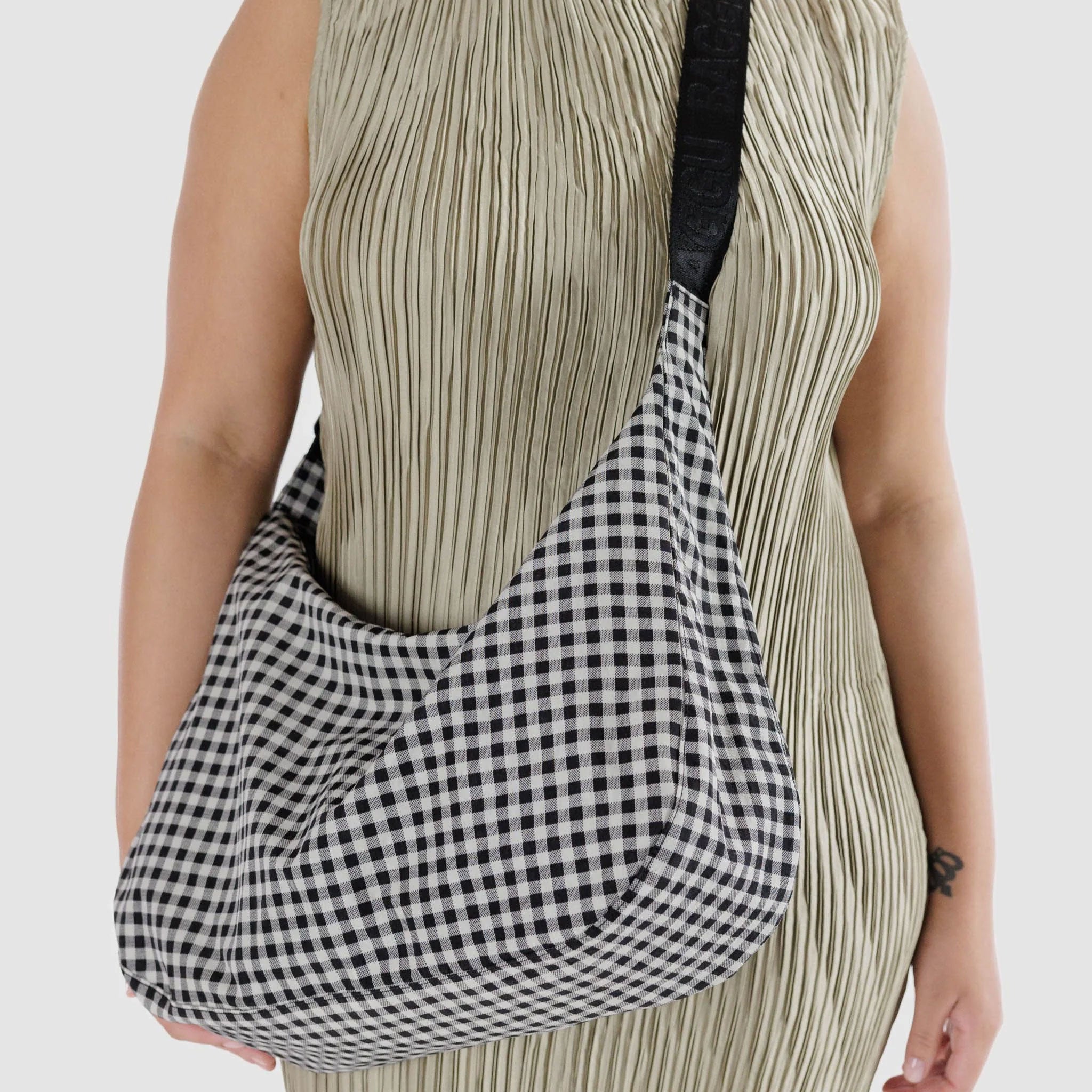 large crescent shaped bag in black and white gingham print