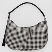 large crescent shaped bag in black and white gingham print