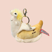 A banana slug stuffed toy bag charm. 