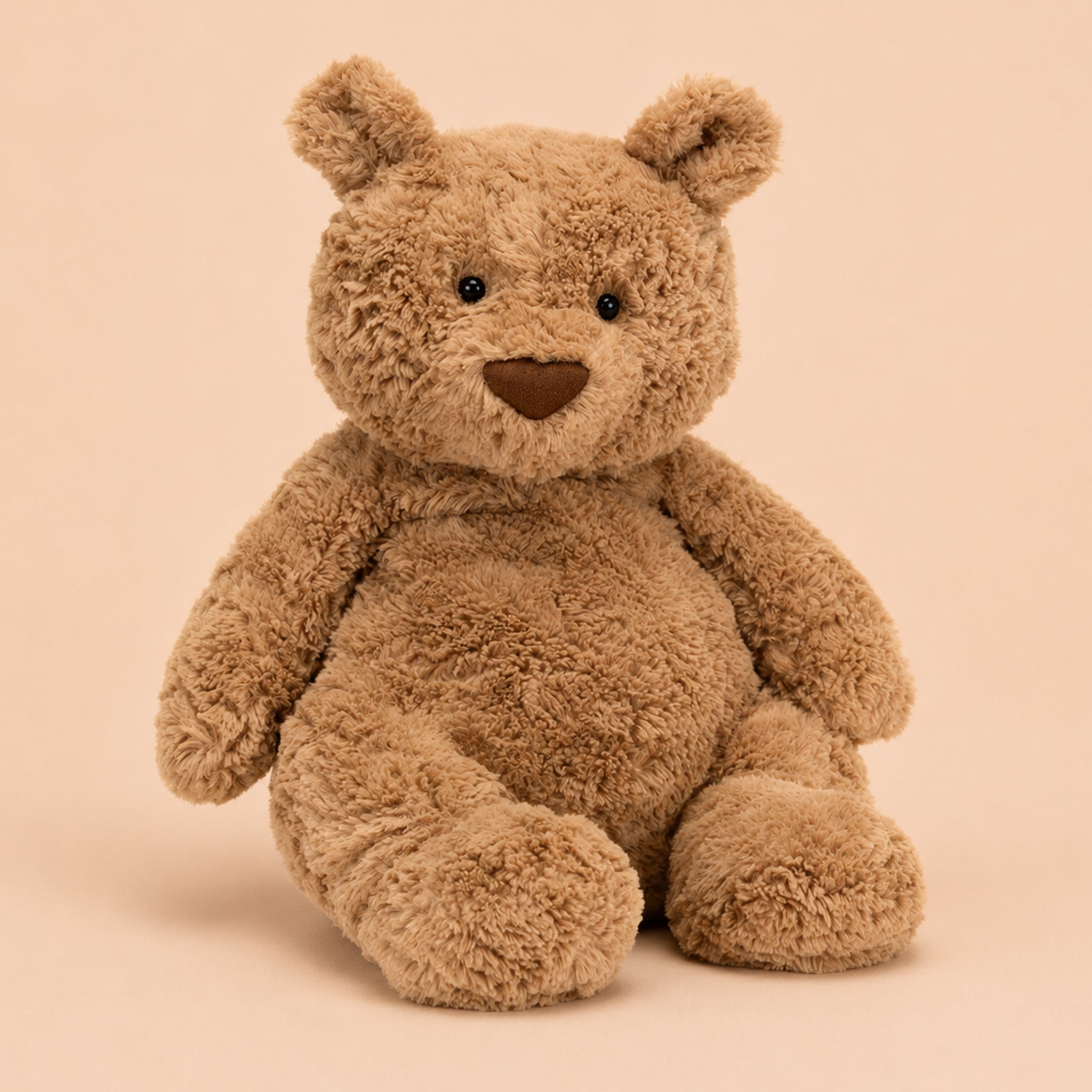 Brown teddy bear on a beige background