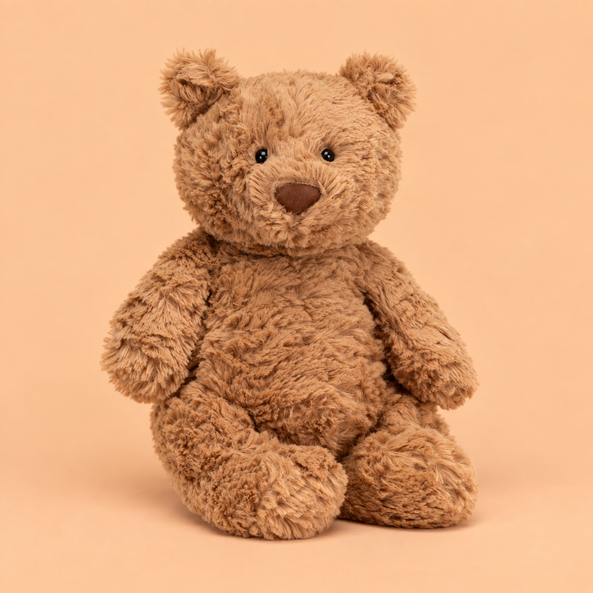 A bear shaped stuffed animal. 
