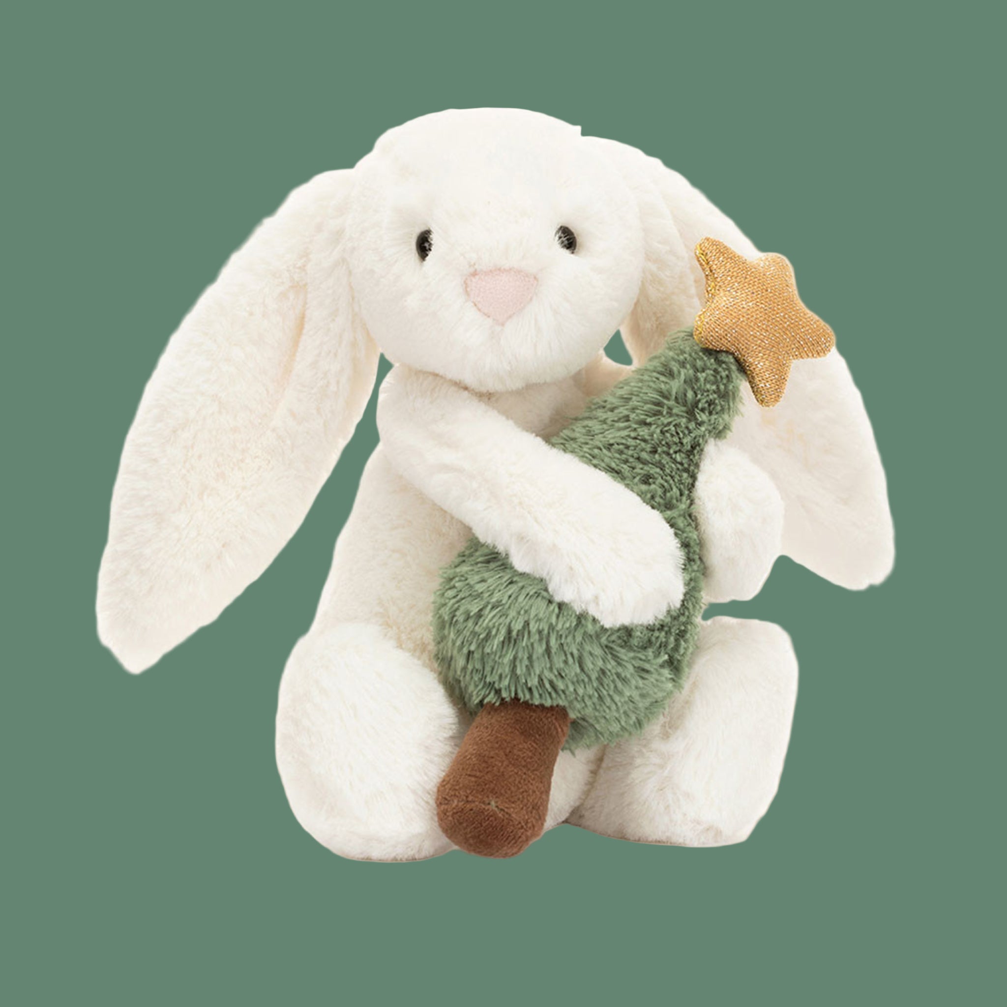 A white bunny shaped stuffed toy holding a green Christmas tree. 