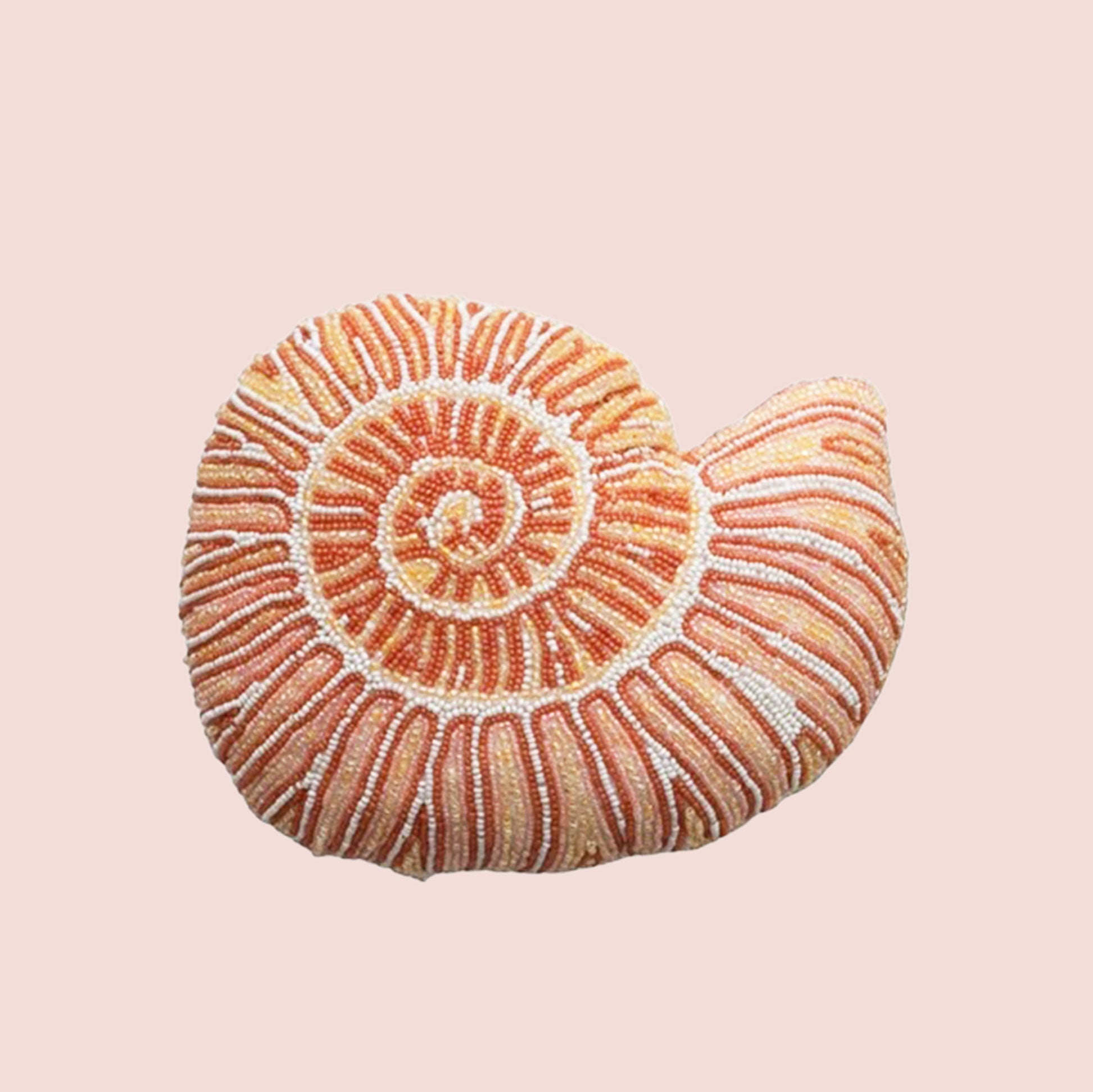A beaded pink and orange shell shaped pillow. 